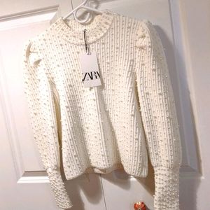 White beaded sweater with puffed sleeves size M.